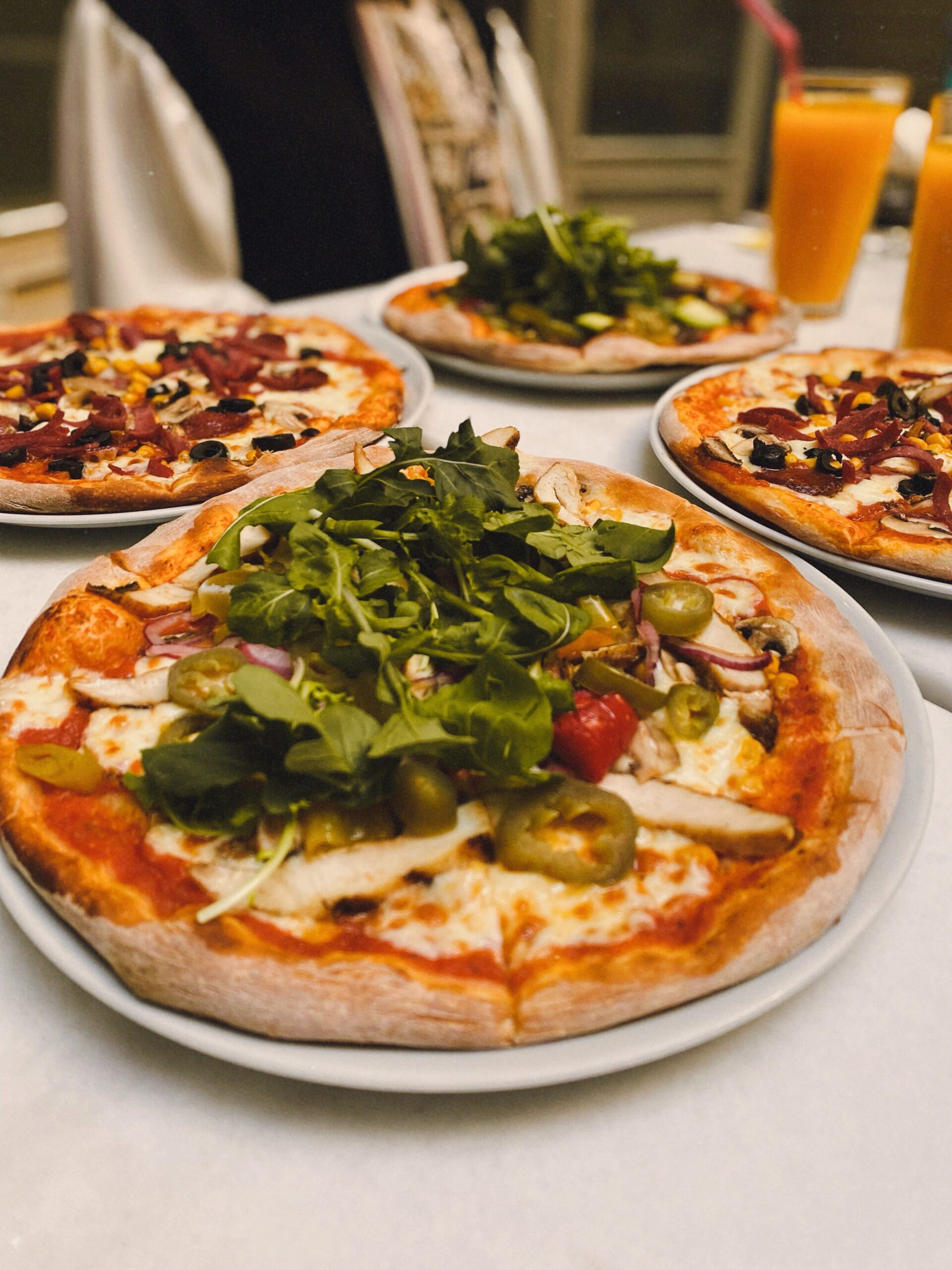 Assorted fresh pizzas on a table